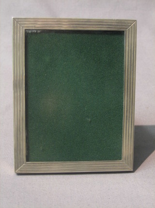 A plain silver easel photograph frame with ribbon decoration 5"