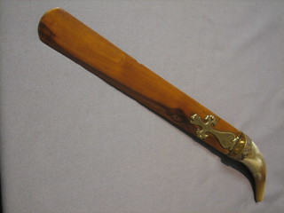 An olive wood newspaper opener with gilt metal and horn handle