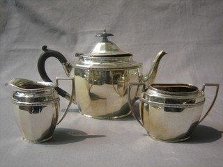A Georgian style silver plated 3 piece tea service of oval form with teapot, twin handled sugar bowl and cream jug