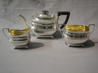 A Georgian style 3 piece silver plated tea service of oval form, raised on bun feet