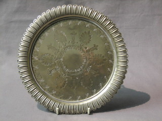 A engraved circular silver plated salver, raised 3 pierced panelled supports 8"