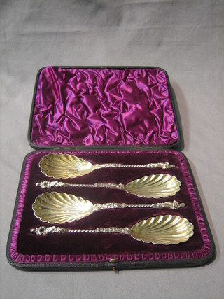 A set of 3 silver plated apostle serving spoons with scallop bowls, cased