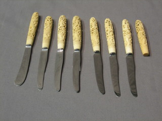 7 tea knives with pierced ivory handles and 1 other