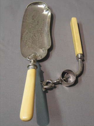 A silver plated crumb scoop and a ham bone clamp
