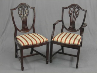 A set of 8 20th Century Hepplewhite style shield and feather back dining chair (2 carvers, 6 standard)