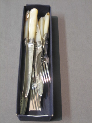 A set of 5 silver plated fruit knives and forks with mother of pearl handles