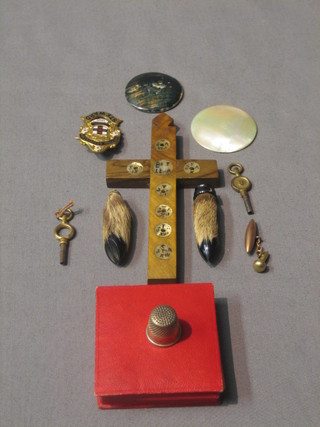 An olive wood and mother of pearl cross, a bronze medallion for the Coronation of Edward VII, a gilt metal and enamel badge, various curios etc