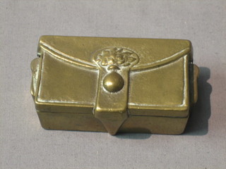 A brass "stamp box" in the form of an ammunition box with hinged lid 3"