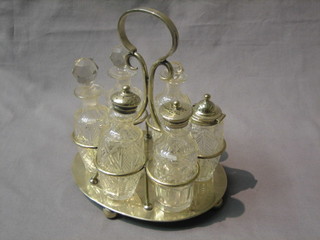 A silver plated oval bottle cruet with 6 bottles