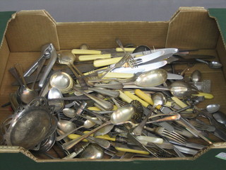 A collection of silver plated flatware