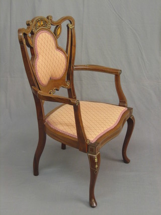 An Edwardian inlaid mahogany and rosewood open arm chair, raised on cabriole supports