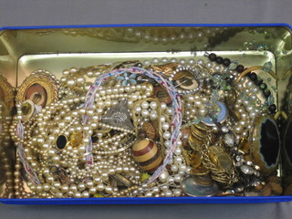 A collection of costume jewellery including a tie pin, foxes mask brooch, etc