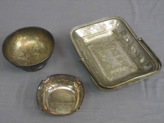 A rectangular embossed silver plated cake basket with swing handle 10", a circular sugar bowl 6" and a pierced silver plated bowl 5"