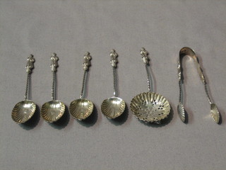 A set of 4 Victorian silver apostle spoons, a matching sifter spoon and sugar tongs, London 1895