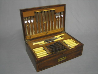 A 57 piece canteen of silver plated flatware contained in an inlaid mahogany box with hinged lid