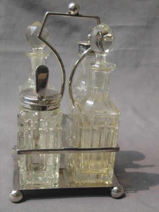 A 4 bottle cruet frame complete with cut glass bottles