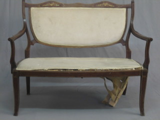 An Edwardian inlaid mahogany double chair back settee, raised on cabriole supports 45"