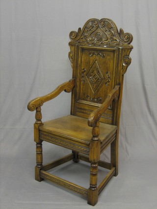 A 20th Century heavily carved oak Wainscot chair