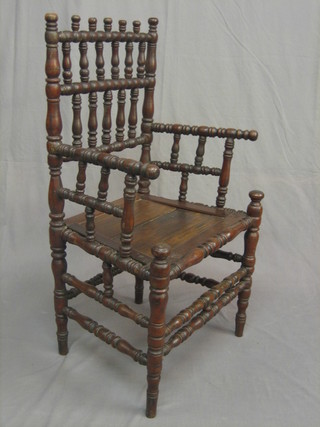 An 18th/19th Century turned fruitwood carver chair, raised on turned columns