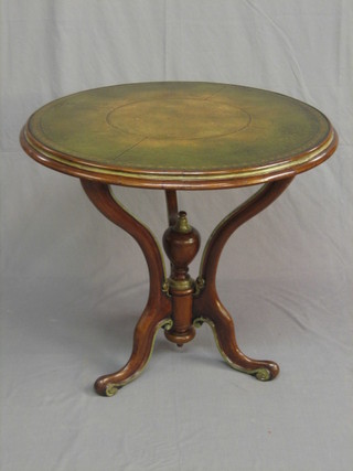A French 19th Century walnut occasional table with inset leather top, raised on scrolled supports 31"