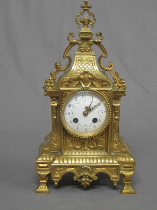 A French 19th Century striking mantel clock with enamelled dial and Arabic numerals contained in a gilt metal case