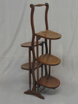 An Edwardian inlaid mahogany 5 tier folding cake stand