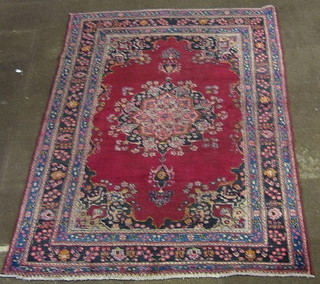 A contemporary red ground Tabrez rug with medallion to the centre within multi row borders 117" x 77"