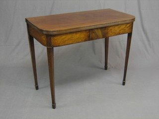 A Georgian mahogany D shaped tea table, raised on square tapering supports ending in spade feet 38"