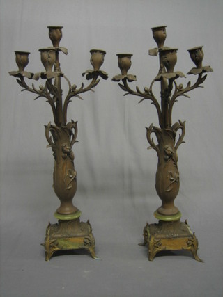 A pair of Art Nouveau gilt painted spelter 4 light candelabrum, raised on green onyx bases 29" (f)