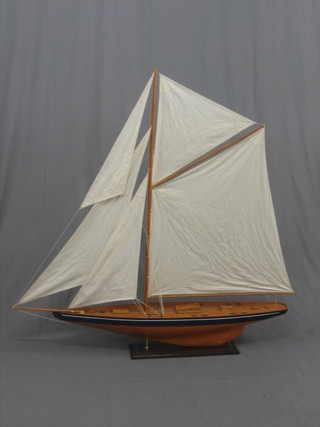 A 20th Century wooden model of a J Class? yacht 55"