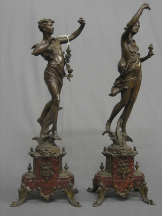 A pair of 19th Century French spelter classical figures, raised on a red marble base (1f) 23"