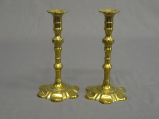 A pair of 17th/18th Century brass candlesticks with petal bases  8 1/2"