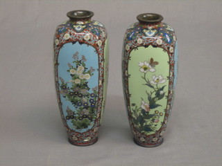 A good pair of 19th Century Japanese square cloisonne enamel vases decorated birds amidst flowering branches against a green and turquoise ground, 7" (1 with chip to rim)