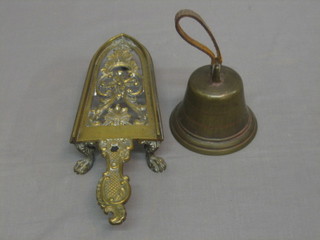 A good 19th Century pierced brass iron stand 11" together with a  brass hand bell