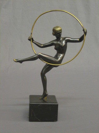 A reproduction Art Deco bronze and marble figure of a standing girl with hoop 12"