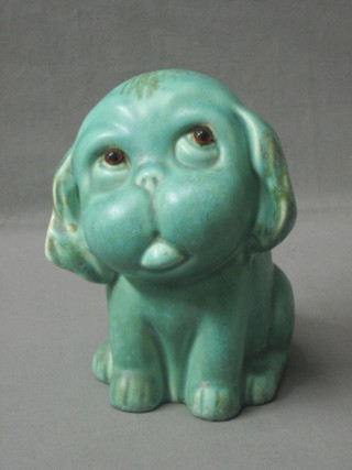A Crown Devon pottery figure of a green  glazed seated dog with hardstone eyes, the base marked 101 Royal Crown Devon England 6"