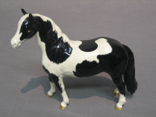 A Beswick figure of a standing black and white horse 6 1/2"