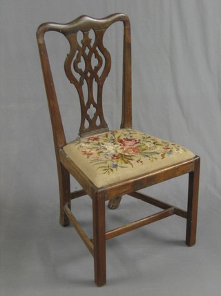 An 18th Century Country mahogany Chippendale style splat back chair with upholstered drop in seat, raised on square supports united by a box framed stretcher