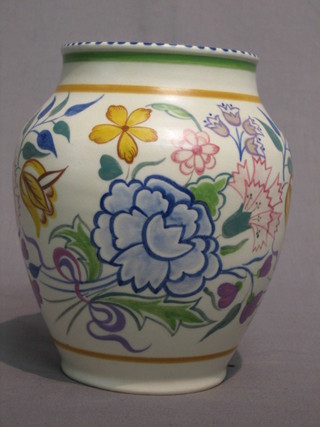 A circular Poole pottery vase with floral decoration, the base impressed Poole England and incised 619, 7"