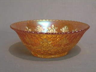 An orange Carnival glass bowl with wavy border, cast body, 8 1/2"