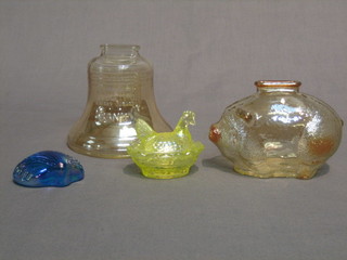 A glass money box in the form of The Liberty Bell 4", a glass piggy bank in the form of a pig 3", a blue glass paperweight in the form of a shell 2" and a green Carnival glass miniature egg store and cover 1/2"