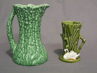A green glazed Sylvac vase in the form of reeds, the base decorated a swan, impressed 4377 6" and a green glazed Sylvac jug 9" (2)