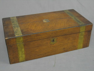 A Victorian walnut writing slope with hinged lid and brass banding (crack to top and some damage) 20"
