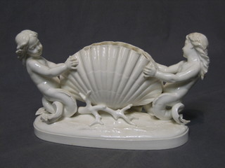 A 19th Century Moor & Co blanc de chine porcelain vase in the form of a clam shell supported by 2 young mermaids (heavily chipped to tails) 7"