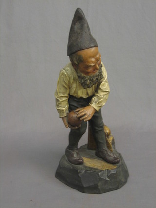 A handsome 19th Century Continental terracotta figure of a standing bowling gnome, the base impressed J Mm 6407, 21" high (head f and r)