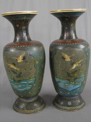 A pair of 19th Century Oriental club shaped "cloisonne" and porcelain vases  decorated storks amidst branches (1 f and r to spout, 1 cracked to base) 24"