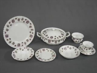 A 48 piece Royal Albert Sweet Violet dinner/tea service comprising circular twin handled tureen and cover 9", an oval platter 13", a twin handled cake plate 12", 2 oval dishes 9", a sauce boat and stand, twin handled dish 9", 6 dinner plates 10 1/2", 6 tea plates 6 1/2", sugar bowl, 2 circular dishes 6 1/2", 6 bowls 6 1/2", 10 cups and 10 saucers