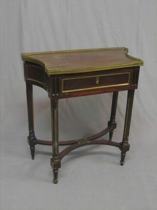 A French 19th Century shaped side table with pierced brass gallery, the base fitted a drawer, raised on turned and fluted supports with X framed stretcher 28"
