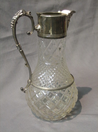 A moulded glass claret jug with silver plated mounts