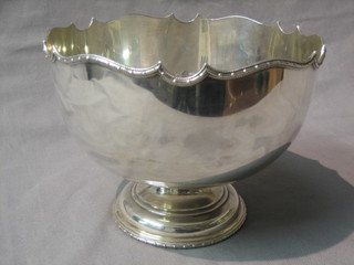 A silver pedestal rose bowl with wavy border, raised on a circular spreading foot, Sheffield 1924, 15 ozs